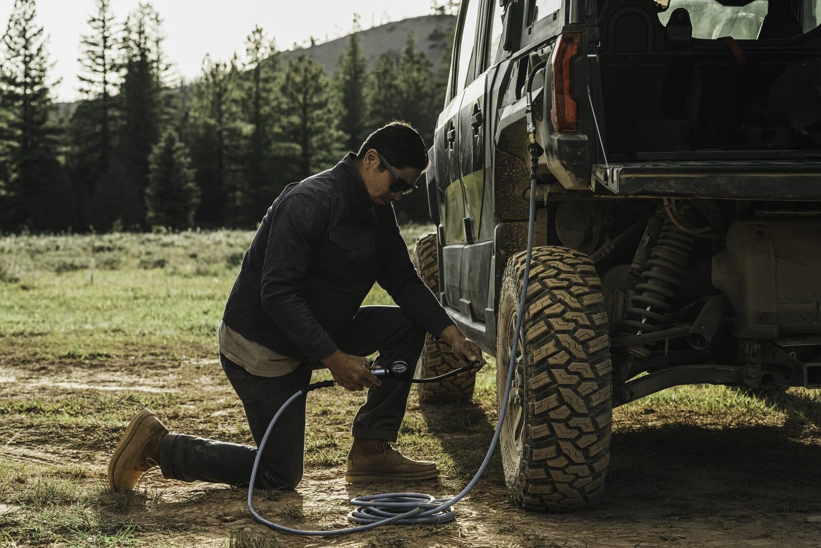 The integrated onboard air system lets riders air up a tire without packing a portable compressor.